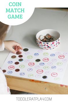 a child is playing with coin match game