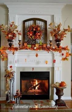 the fireplace is decorated with candles and pumpkins