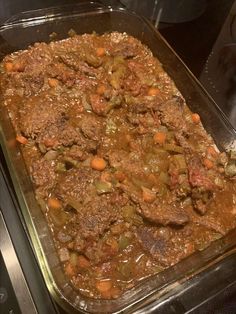 a casserole dish with meat and vegetables in it