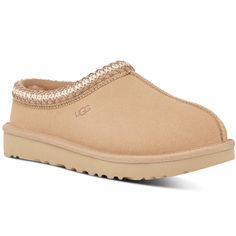 Women's Ugg Tasman Slipper A slipper for all occasions, our best-selling Tasman features the same light, durable outsole as our Classic boot, so you can wear it both indoors and out. Lined with plush natural wool, it’s crafted from soft suede with an embroidered braid and easy slip-on silhouette. Pair with boyfriend jeans and a knit sweater. This product was made in a factory that supports women in our supply chain with the help of HERproject, a collaborative initiative that creates partnerships Ugg Tasman Slippers, Ugg Tasman, Platform Flats, With Boyfriend, Ugg Slippers, Classic Boots, Real Fur, Women Supporting Women, Supply Chain