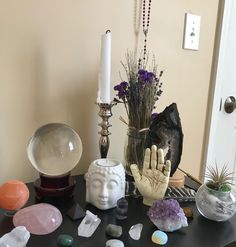 a table topped with lots of different types of crystals