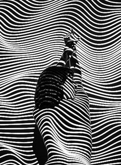 an abstract black and white photo with wavy lines