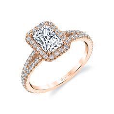 a rose gold engagement ring with a princess cut diamond surrounded by pave and round diamonds