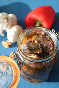 a jar filled with food sitting on top of a blue table