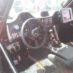 the interior of a car with dashboard and steering wheel