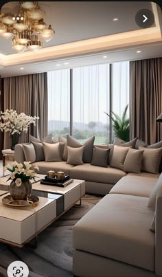 a living room filled with lots of furniture next to a window covered in drapes