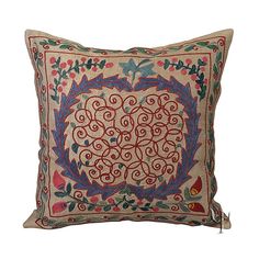 an embroidered pillow on a white background