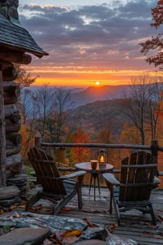 two chairs sitting on top of a wooden deck next to a table and chair covered in leaves