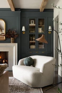 an image of a living room with fireplace and bookcases on the front page