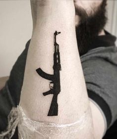 25 of the Best Gun Tattoos - Tattoo Insider Tattoo Ak47, Ak47 Tattoo, Tattoos For Women Small Meaningful, Tatuagem Masculina Pequena, Simple Tattoos For Women, Snake Tattoo, Hand Tattoo, Mom Tattoos, Star Tattoos