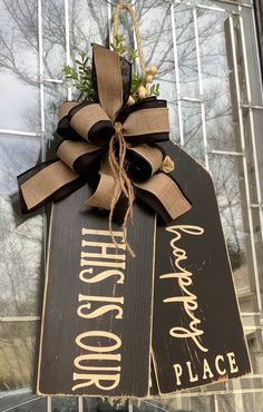 a door hanger decorated with burlock and ribbon