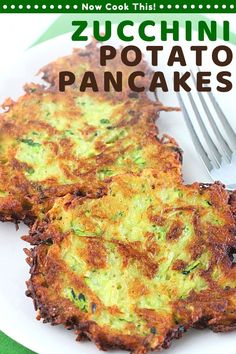 two zucchini potato pancakes on a white plate with a fork next to it