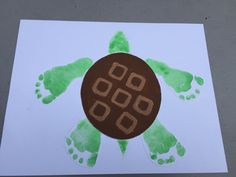 an image of a handprinted turtle on paper