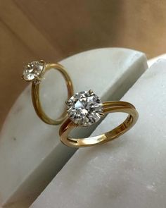 an engagement ring with two diamonds on it