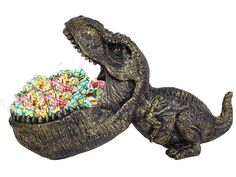 a fake alligator eating a bowl of sprinkles