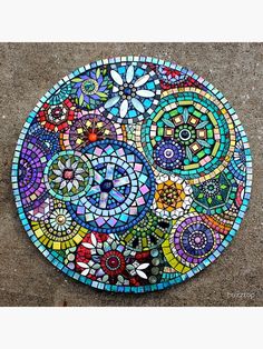 a colorful mosaic design on the ground