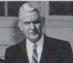 an old black and white photo of a man in a suit