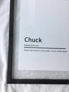 a black framed print with the words chuck and some type of text below it that reads,