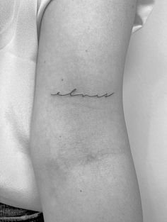 a woman's thigh with a small wave tattoo on her left side ribcage