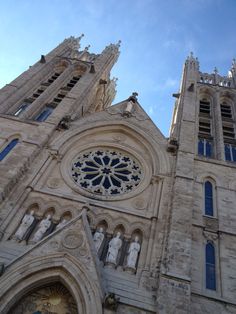 two large cathedrals with blue windows against a blue sky