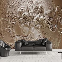 a living room filled with furniture and a large wall mural