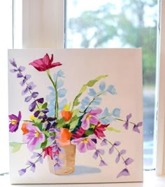 a painting of flowers in a vase sitting on a window sill next to a window