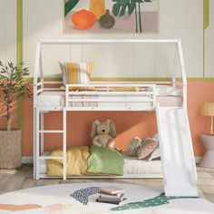 there is a bunk bed with a slide on the bottom and a stuffed animal in it