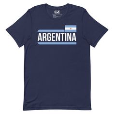 Fans of Argentina soccer team this retro Argentina T-shirt is for you! This t-shirt is everything you've dreamed of and more. It feels soft and lightweight, with the right amount of stretch. It's comfortable and flattering for all. • 100% combed and ring-spun cotton (Heather colors contain polyester) • Fabric weight: 4.2 oz./yd.² (142 g/m²) • Pre-shrunk fabric • Side-seamed construction • Shoulder-to-shoulder taping • Blank product sourced from Nicaragua, Mexico, Honduras, or the USSize guide LENGTH (inches) WIDTH (inches) CHEST (inches) S 28 18 34-37 M 29 20 38-41 L 30 22 42-45 XL 31 24 46-49 2XL 32 26 50-53 3XL 33 28 54-57 4XL 34 30 58-61 LENGTH (cm) WIDTH (cm) CHEST (cm) S 71.1 45.7 86.4-94 M 73.7 50.8 96.5-104.1 L 76.2 55.9 106.7-114.3 XL 78.7 61 116.8-124.5 2XL 81.3 66 127-134.6 3XL 8