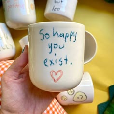 someone holding up a coffee mug with writing on it that says, so happy you're exit