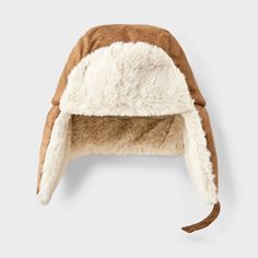 Keep your little one cozy all winter with this Suede Faux-Fur Trapper Hat from Cat & Jack™. This trapper hat is crafted from heavyweight fabric with faux fur and full lining, complete with functional ear flaps to keep the warmth in and the cold out. Plus, it features a chinstrap hook-and-loop fastener for a snug, stay-put fit. Cat & Jack™: Designed for all children so you can trust it's made for yours. Adjustable Hats With Faux Fur Trim For Cold Weather, Adjustable Faux Fur Trim Hats For Cold Weather, Adjustable Faux Fur Trim Cold Weather Hats, Brown Hat With Plush Lining For Cold Weather, Plush Lined Cap For Cold Weather, Cold Weather Cap With Plush Lining, Faux Fur Hats With Plush Lining For Cold Weather, Faux Fur Hat With Plush Lining For Cold Weather, Adjustable Cap With Plush Lining