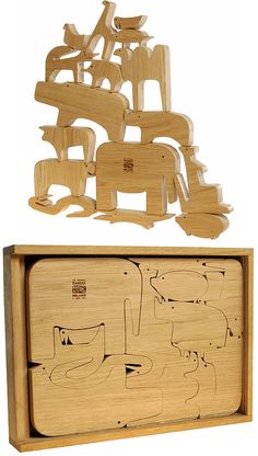 a wooden box with cut out animals in it