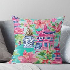 a decorative pillow on a couch with flowers and pagodas in the background throw pillow