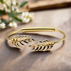 Unleash Your Inner Goddess With This Beautiful, 18k Gold Plated Brass Bangle Bracelet. Add Style To Your Look With This Elegant, Laurel Leaf Piece. 18k Pvd Gold Plated Brass - For An Affordable High-End Look Inner Diameter: 2.25" - Allows For Sliding Up The Arm Laurel Leaf Motif - Creates A Regal Statement Imported From China - To Bring You The Best Possible Price This Product Has Been Curated By Tammy To Complement Our Handmade Collections. T. Randall Jewelry Is A Woman Owned Jewelry Brand That Laurel Leaf, Laurel Leaves, Brass Bangle, Leaf Bracelet, Inner Goddess, Leaf Motif, Stainless Steel Bangles, Leaf Jewelry, Jewelry Brand