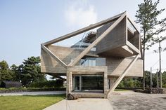 an unusual wooden house in the middle of a park