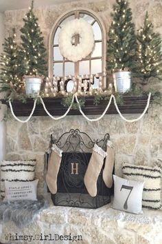 a mantle with stockings and christmas trees on it