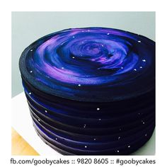 a stack of blue and purple plates on top of each other in front of a white background