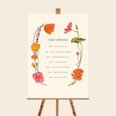 an easel with flowers on it and the words order of the day written below