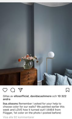 a bedroom with blue walls and furniture in the corner, is featured on instagram