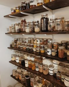 shelves filled with lots of different kinds of jars