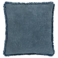 a blue pillow with fringes on the edges and a square shape in the middle