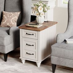 a living room with two chairs, a table and a flower vase on the end table