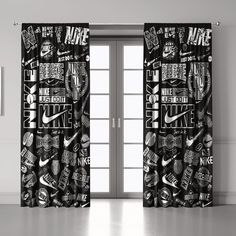 black and white graphic curtains with the words nike printed on them in front of a window