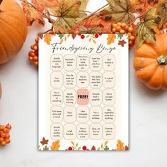 a free thanksgiving printable is shown next to some pumpkins and other autumn decorations