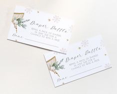 two white business cards with gold and green designs on them, one has a harp