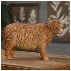 Dimensions: 7.31" H x 11" W x 5" D Material: Resin Shape: Novelty Color: Tan & White Orientation: Horizontal Quantity: 1 Add a touch of country charm to your home when you place this Tan Highland Cow on your counter or tabletop. This resin highland cow figurine is perfect for accenting your other Western and farmhouse decor. Its four hooves have flat bottoms and provide a stable base, so it won't fall over. Display it with matching themed decor to enhance your home's country style! Western Knick Knacks, Kitchen Decor Western, Hobby Lobby Western Decor, Highland Cow Home Decor, Western Vintage Decor, Western Home Decor Diy, Boys Cowboy Room, Yellowstone Decor, 2025 Bedroom