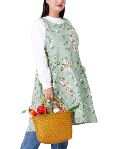 a woman holding a basket full of vegetables