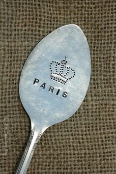 a spoon with the word paris on it