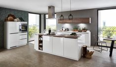 a modern kitchen with white cabinets and wood counter tops, along with an island in the middle