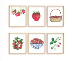 four framed pictures with strawberries and strawberrys in them on a white wall above a basket