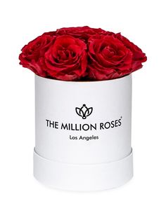 red roses in a white box with the logo of the million roses los angeles on it